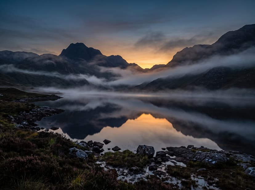 Misty Scottish Highlands loch at dusk